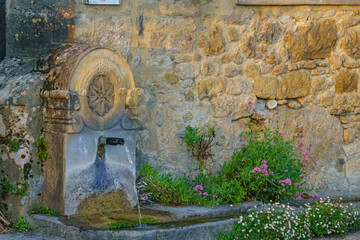 Stone fountain of Beynac et Cazenac, France