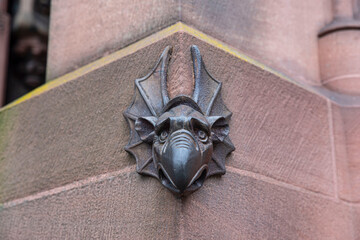 Metal gargoyle on the facade of Strasbourg cathedral in France