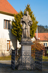 Statue of St. John of Nepomuk. Historical monument. The town of Sloup in the Moravian Karst, South Moravia, Czech Republic.