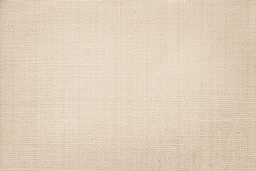 Jute hessian sackcloth canvas woven texture pattern background in light beige cream brown color blank empty