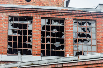 Broken windows in abandoned building.