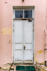 antique door on the background of broken steps