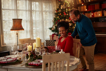 Sweet couple having a romantic dinner at Christmastime