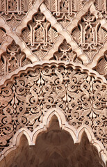 Ancient stone arch with carved floral ornaments, Morocco