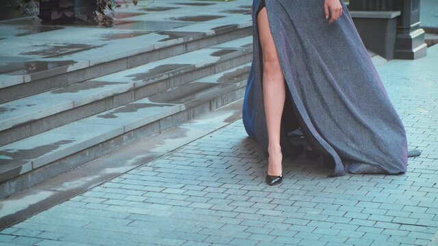 Close-up beautiful sexy female legs Black high heel shoes. Girl adult walks 