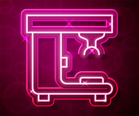 Glowing neon line Coffee machine icon isolated on red background. Vector