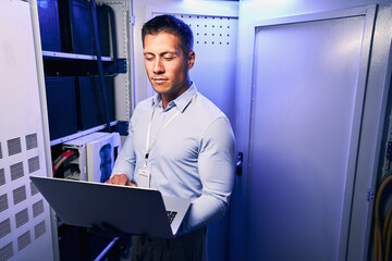 Serious IT professional doing diagnostic tests on network servers