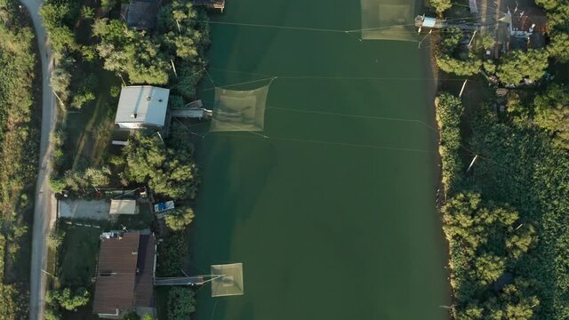 Aerial view of fishing huts in the river, Lido di Dante, Fiumi Uniti, Ravenna near Comacchio valley.
