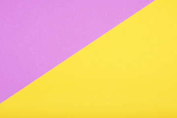 two-tone color paper background in yellow and pink