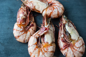 Prawn sea shrimp grilled on black plate