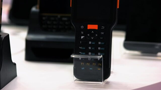 Mobile phone with buttons in the store.