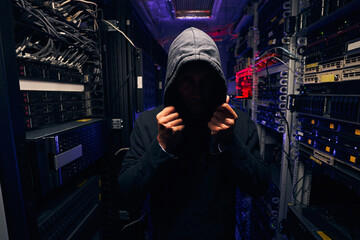 Fototapeta na wymiar Data center intruder trying to cover his face