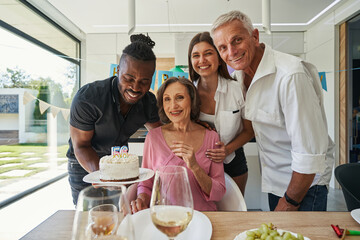 African American man holding plate of cake