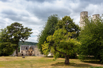 Fototapeta na wymiar Normandy, France, July 14, 2019 - Jumieges Abbey (Abbaye Saint-Pierre de Jumieges). View on th abbey from garden in beautiful summer day