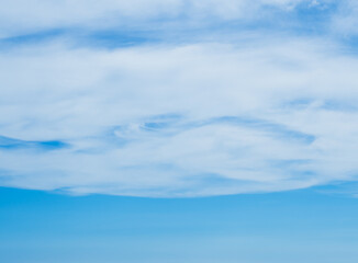 beautiful view of clouds in the blue sky background. Clouds cape in the sunlight.