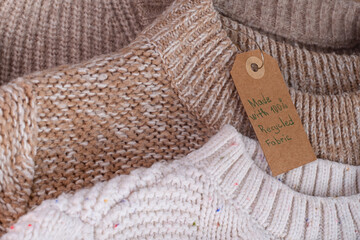 Clothing recycling. Ecological and sustainable fashion. Set winter knitted sweater with a tag.
