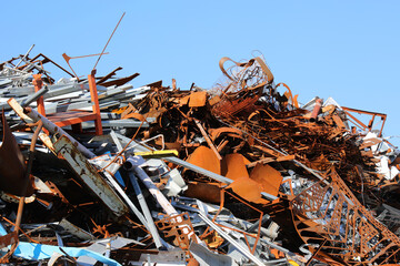 pile of many rusty pieces of iron in the recycling center for the recovery of metal material