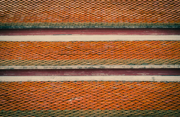 Old ceramic roof top in Thai temple, vintage tone picture