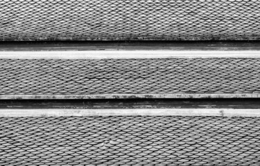 Old ceramic roof top in Thai temple, vintage tone picture