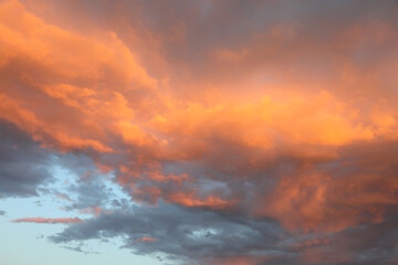 romantic sky with red and orange colored clouds from the setting sun
