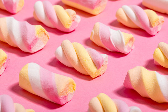 Studio shot of marshmallows flat laid against pink background