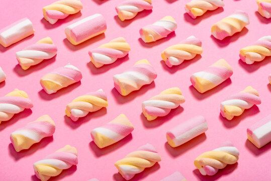 Studio shot of marshmallows flat laid against pink background