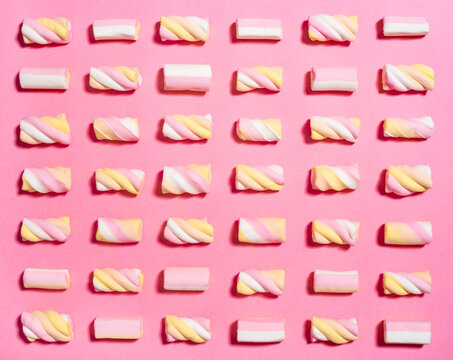 Studio shot of marshmallows flat laid against pink background