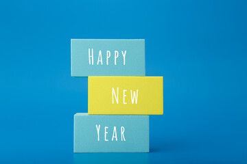Happy New Year elegant minimal concept in blue colors. Stack of rectangles with congratulation text