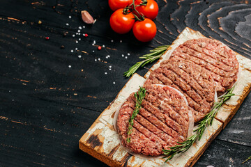 minced meat for burger, beef lamb meat Burger steak cutlets on black background. Top view