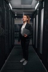 Woman system administrator in network server room