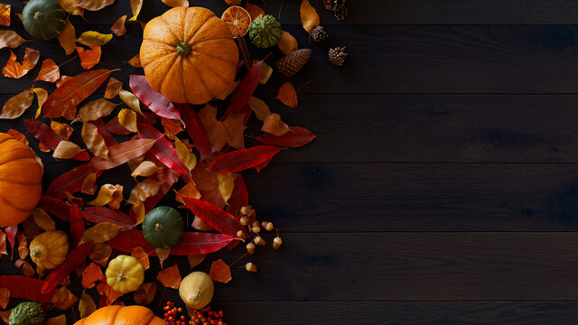 Autumn flat lay with leaves, Gourds and Fruits. Thanksgiving concept with copy space.
