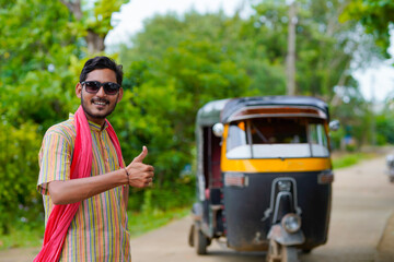 Indian auto rickshaw three-wheeler tuk-tuk taxi driver man.