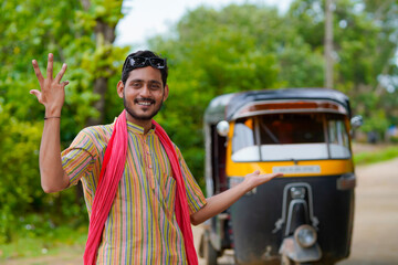 Indian auto rickshaw three-wheeler tuk-tuk taxi driver man.