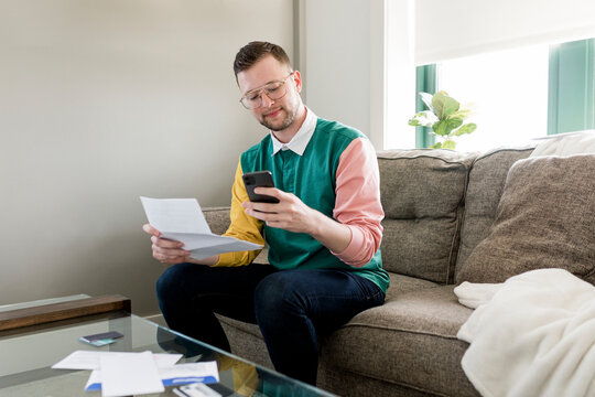 Happy man paying bills, HD stock image