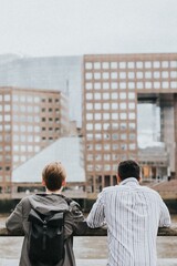 Traveler friends admiring London skyline from a bridge