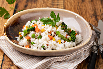 Bowl with tasty rice and vegetables