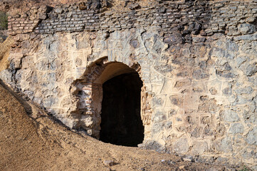 Fototapeta premium Architectural detail of a cave door in the abandoned mazarron mines