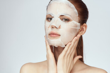 woman in cosmetic mask facial skin care rejuvenation