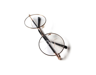 The glass of the eyeglasses cracked on both sides placed on a white background. Isolated.