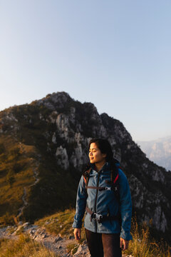 Young woman with eyes closed on mountain