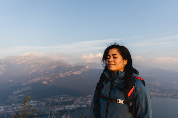 Young hiker inhaling on mountain