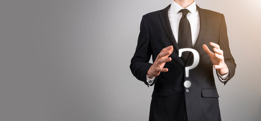 Businessman man hand hold interface question marks sign web. Ask quiestion online, FAQ concept,...