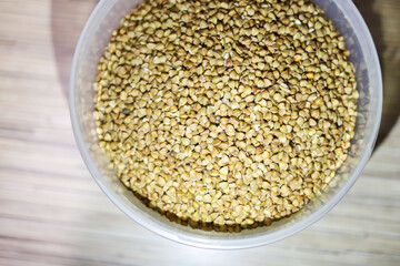 Buckwheat in a plastic jar for cooking porridge