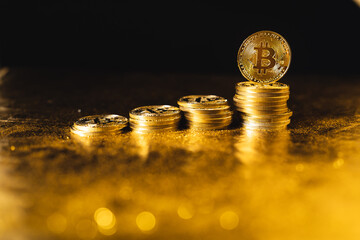 bitcoin growth,bitcoin coins stacked on black gold background