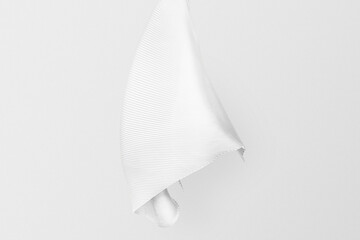 Minimal white scarf against white wall