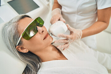 Close up of kind beauty wearing protective glasses