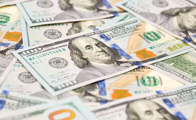 One Hundred Dollar Banknotes are creatively laid out. Money banknotes of US dollars, a lot of different money. Buy printing, banking. Cash income, wealth and financial independence.