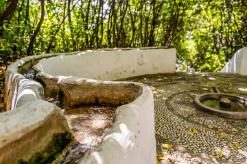 Water flowing in Generalife garden in palace complex called Alhambra in Granada, Spain