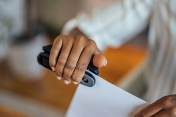 Picture of a stapler check, by piecing paper - obrazy, fototapety, plakaty