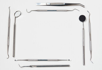 Professional Dentist tools on white background with copy space